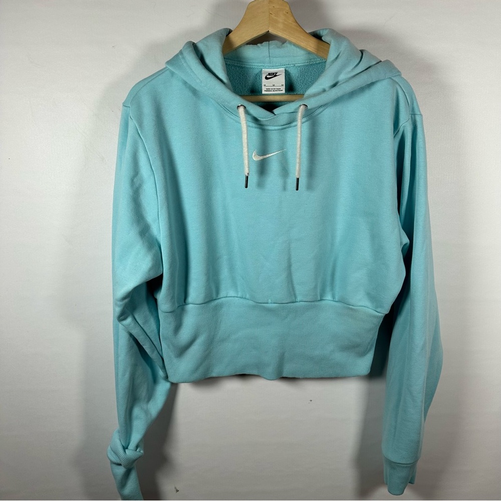 Nike Center Swoosh Women's Light Blue Hoodie slightly cropped.